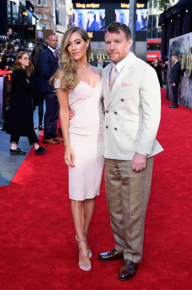 Guy Ritchie with his wife Jacqui, who stunned in a pale pink dress