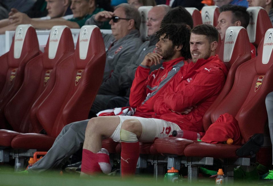 Aaron Ramsey had his leg bandaged as he sat on the bench