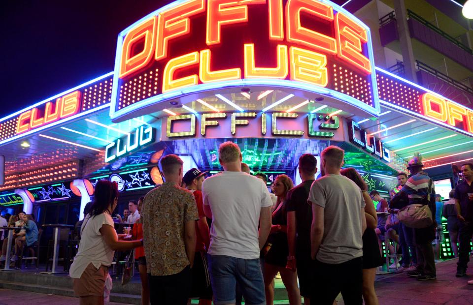  A group of revellers gather outside the bright lights of one of the resort's clubs during a night out this weekend