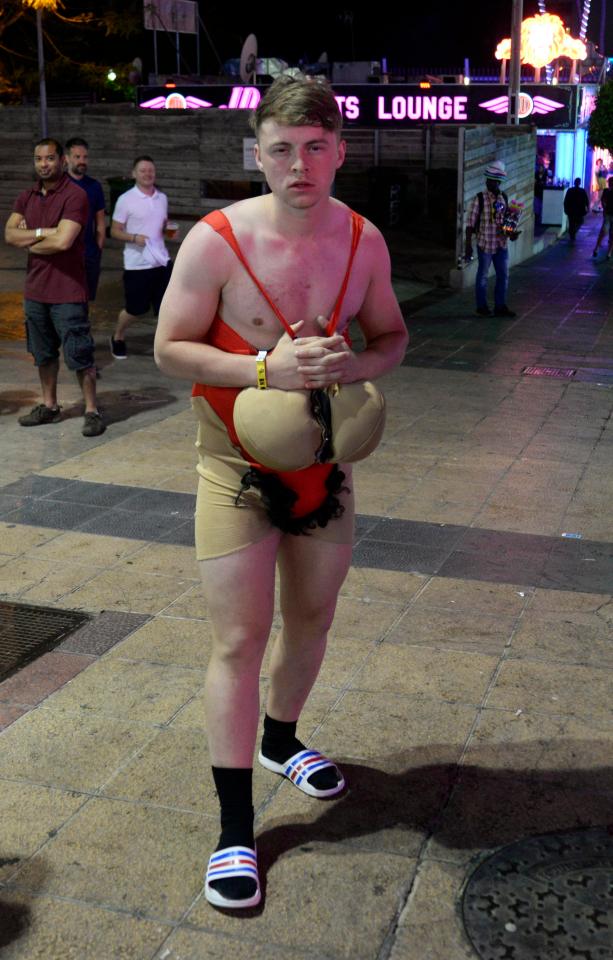  One reveller is seen in a skin-tight costume as he hits the bars in Magaluf