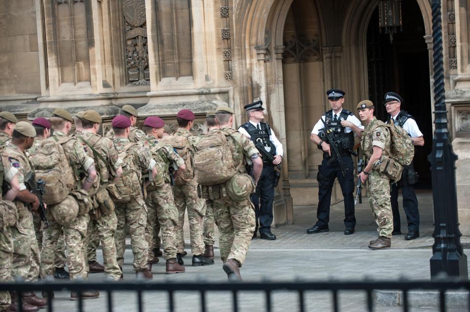  Troops pictured here marching in to Parliament to join armed cops guarding the area in Westminster