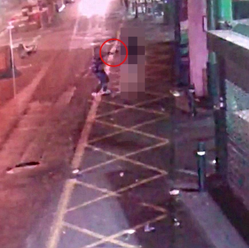 The knifeman swings his knife - circled in red - at the victim as the onslaught begins