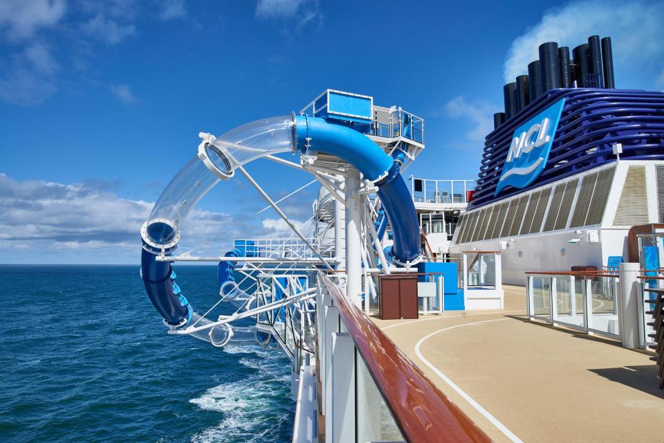 The ship also has two multi-story water slides that loop outside the ship across the sea below 