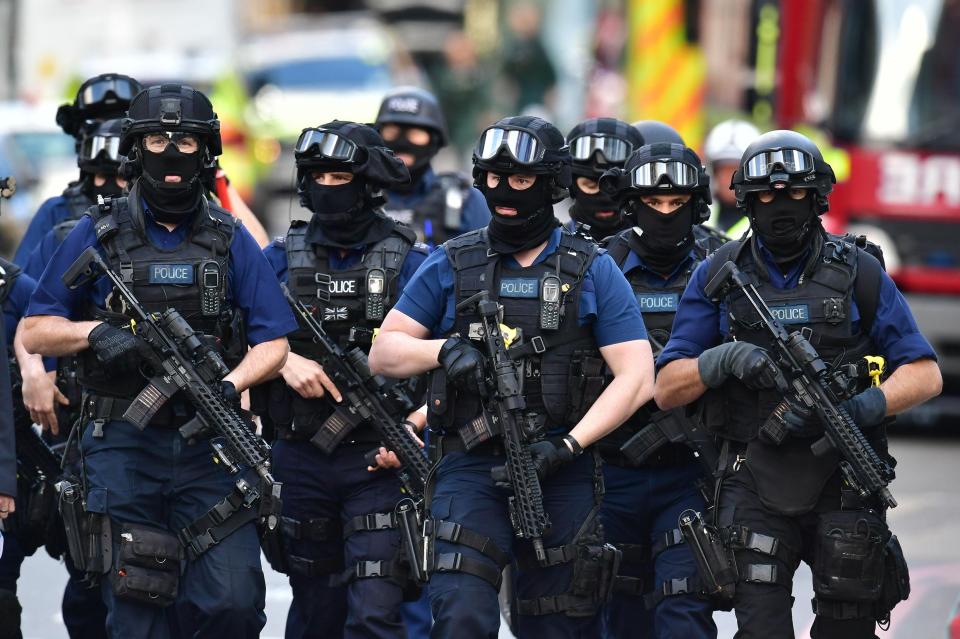  Cops with automatic weapons patrol London Bridge and the surrounding area the day after the terror attack