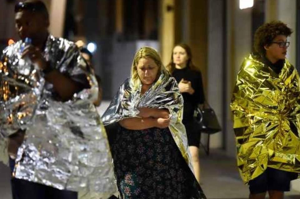  Shocked revellers leave the Black & Blue after the carnage
