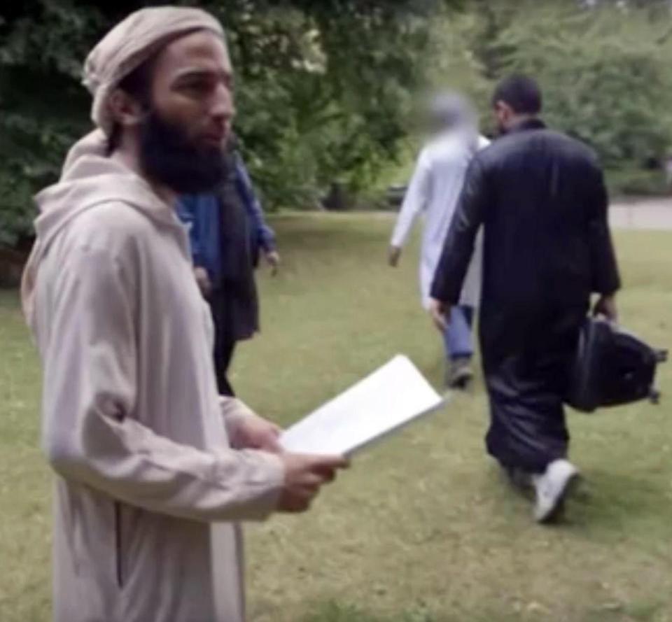 Abz pictured here turning to the camera after posing with the jihadi flag in the park