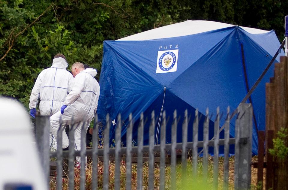  Forensic officers pictured at Ruiton Cemetery, Upper Gornal, West Midlands