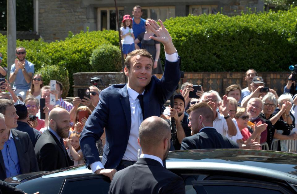  The French president waves to crowds after results showed his party was firmly in the driving seat