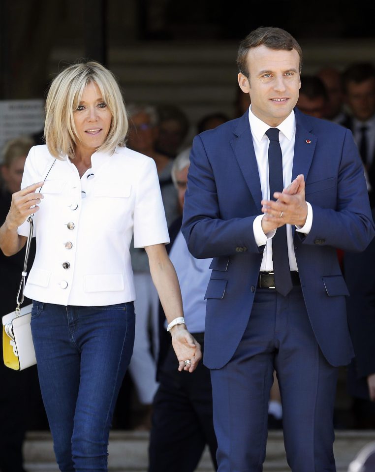  Emmanuel Macron leaves a polling station yesterday with his wife Brigitte