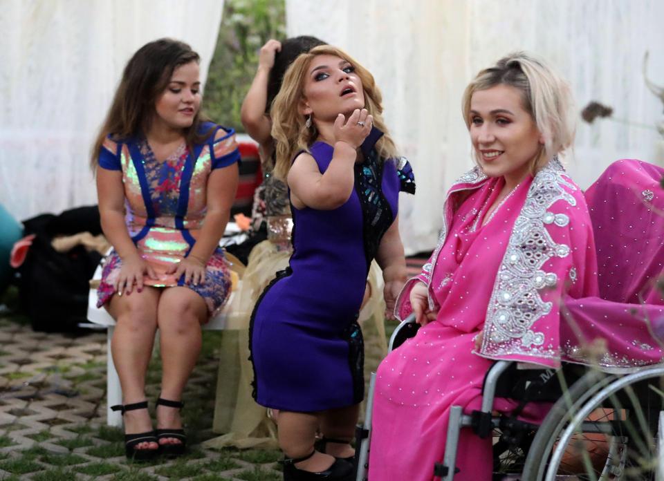  Models pose after the International Dwarf Fashion Show, a non-profit organisation that aims to reverse discrimination in beauty