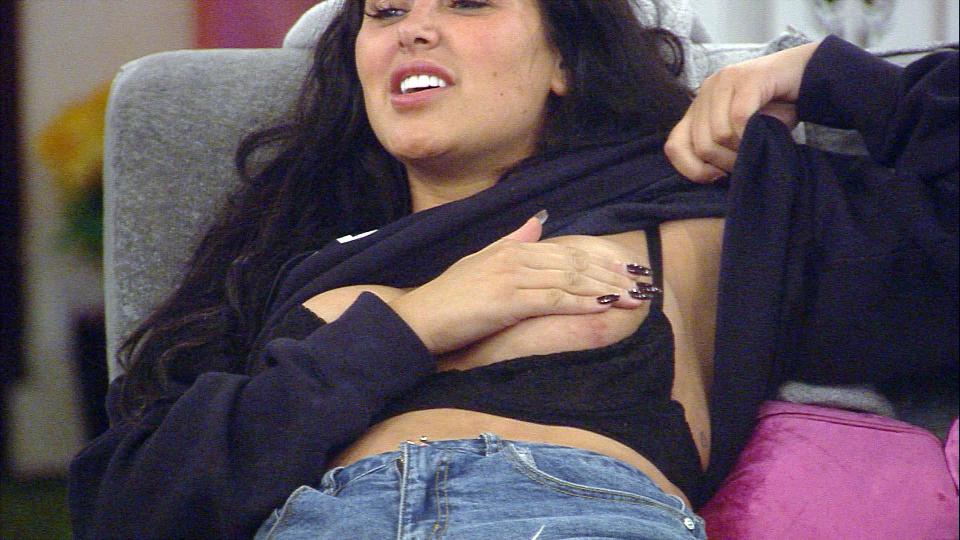 Marnie covered her modesty as she shielded her breast with her hand 