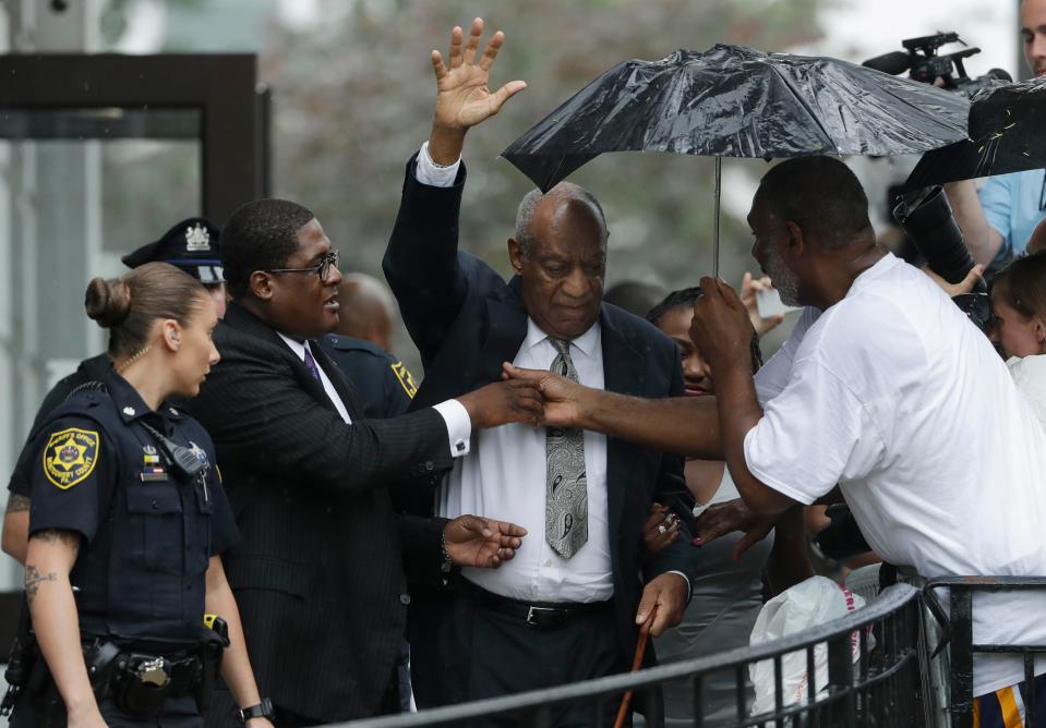 The TV star waved to the media and onlookers as he left