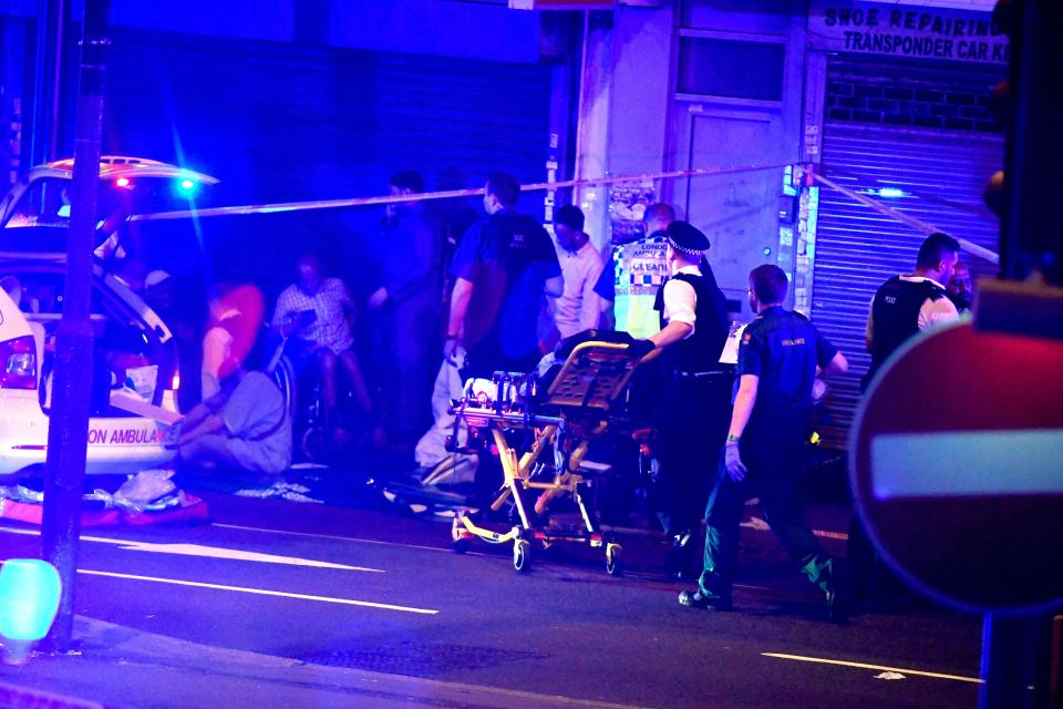 Paramedics from London Ambulance can be seen tending to people injured in the incident