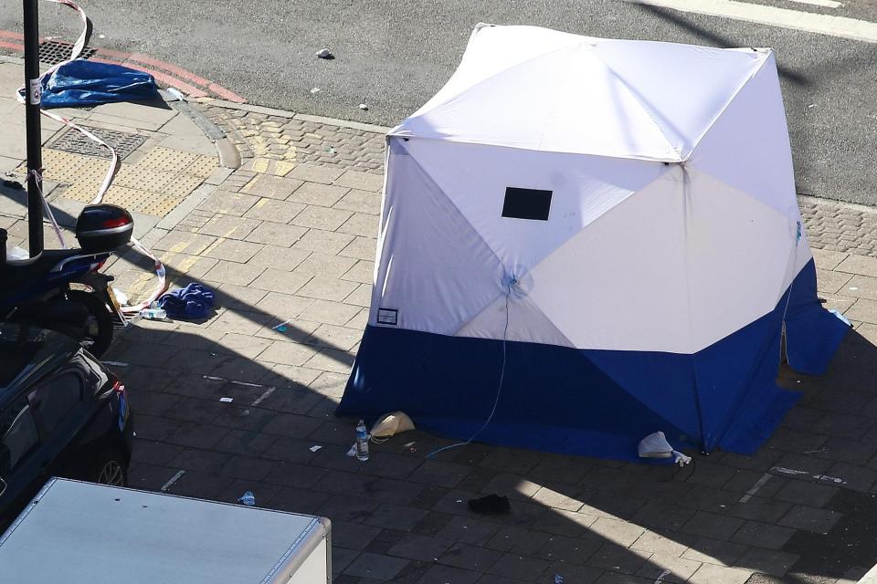  Debris and a forensic officers tent is seen at the scene after a vehicle collided with pedestrians in North London