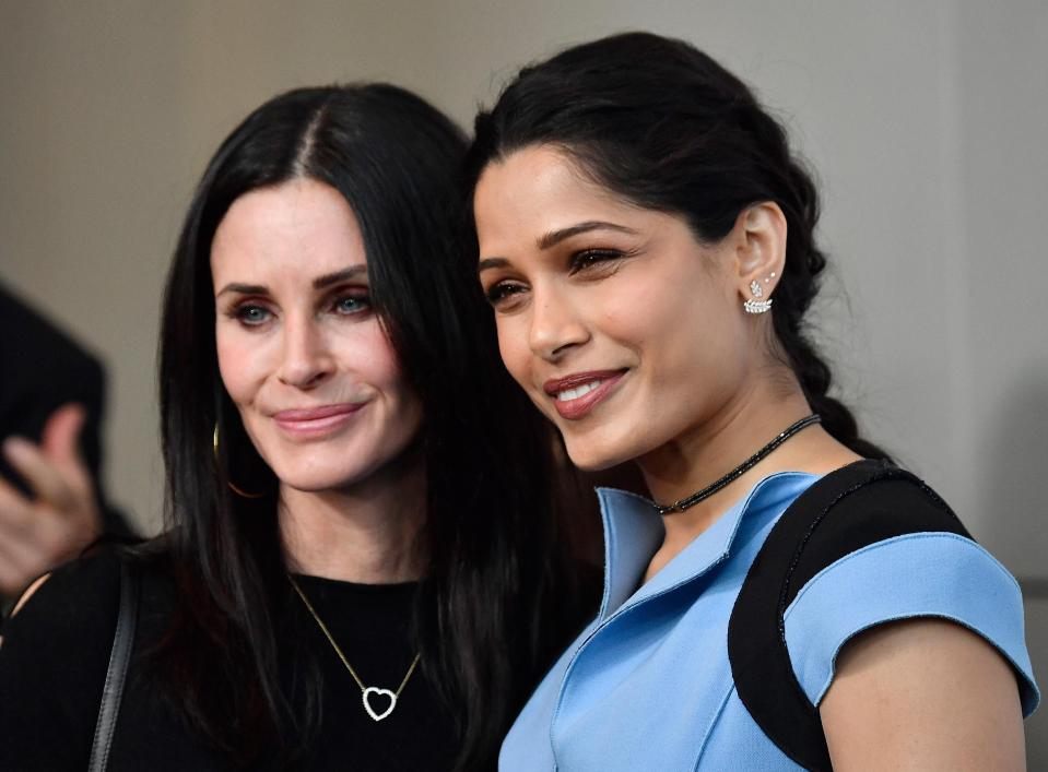  Now Courtney, pictured with Freida Pinto in March 2017, says she's learning to embrace her natural beauty