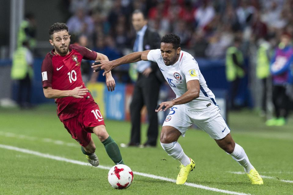  Ex-Wigan and Birmingham defender Jean Beasejour takes on Bernardo Silva