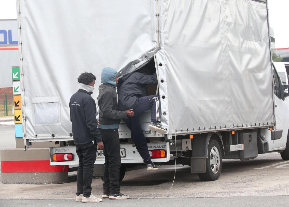  More youths loiter by the motorway which carries freight to the ferry terminals