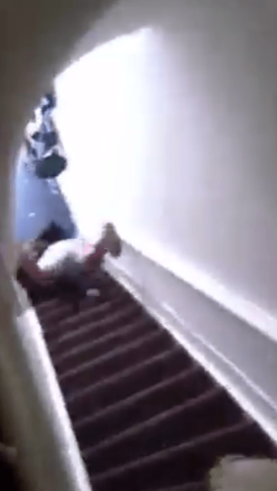  She then tumbles down the stairs to the horror of her colleagues waiting outside the door