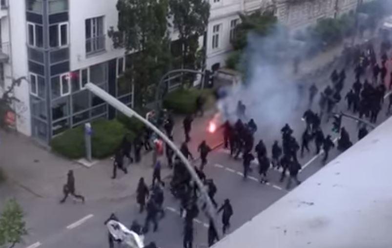  Shocking footage showed marching anarchists throwing flares in the street