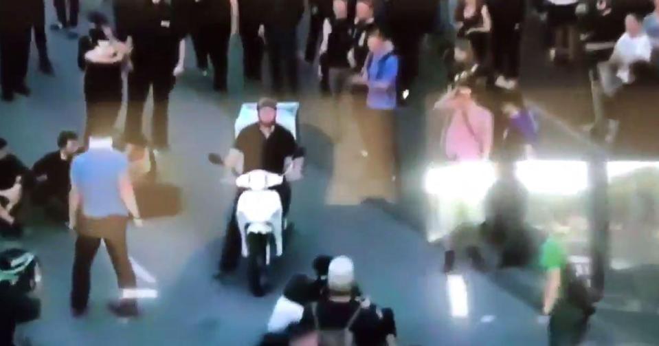  A Domino's pizza delivery driver has been filmed weaving among rioters at the G20 protests in Germany