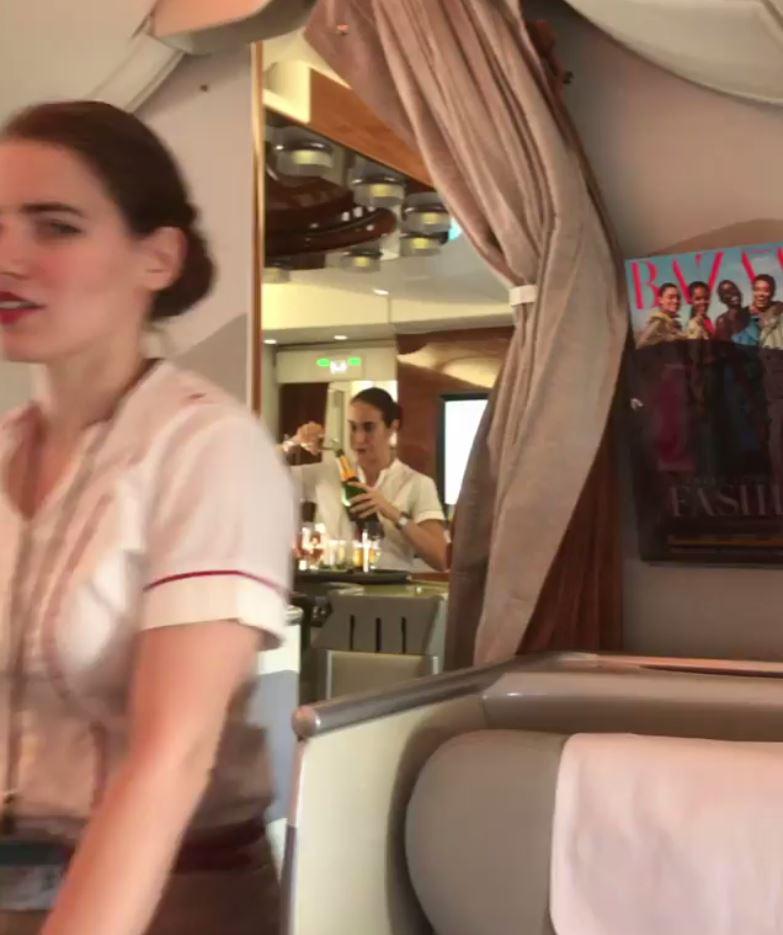 A passenger unwittingly caught the cabin crew member in the act while filming the view from his fancy seat in the A380 upper deck business class cabin