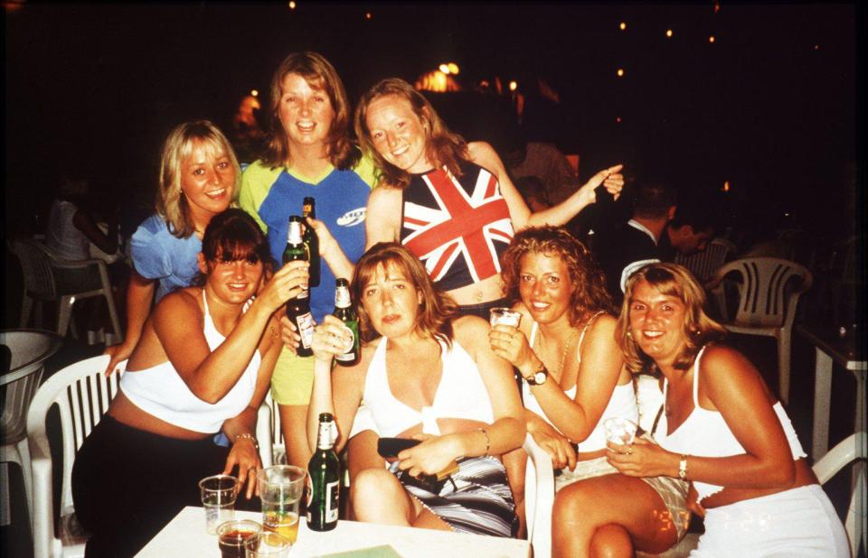 A group of young women pose for a picture during a package holiday in Magaluf in the 1990s 
