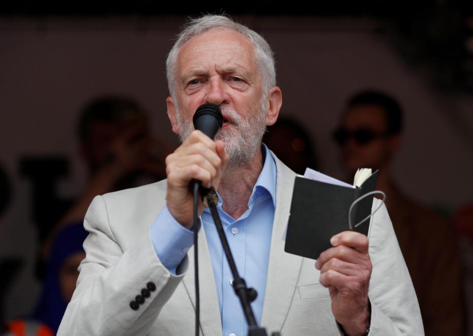  Corbyn addresses protestors at a 'Not One Day More' march at Parliament Square