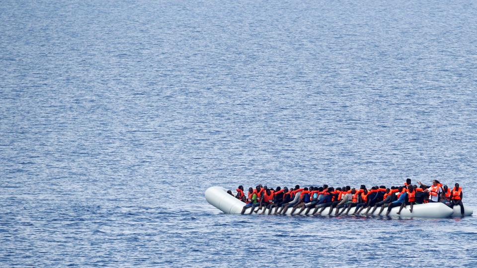  Migrants wait to be rescued by "Save the Children" NGO crew in the Mediterranean sea off Libya coast