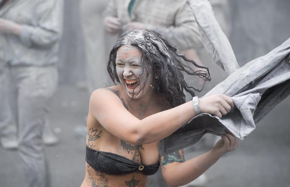 Women were seen ripping off their grey clothes