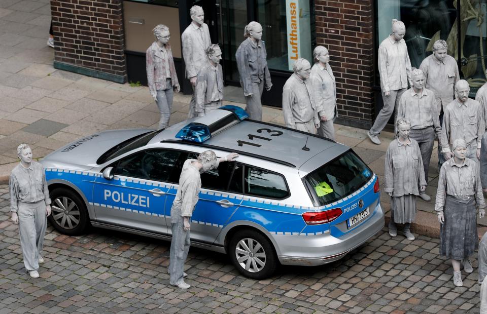 Chilling images show activists surrounding police cars 