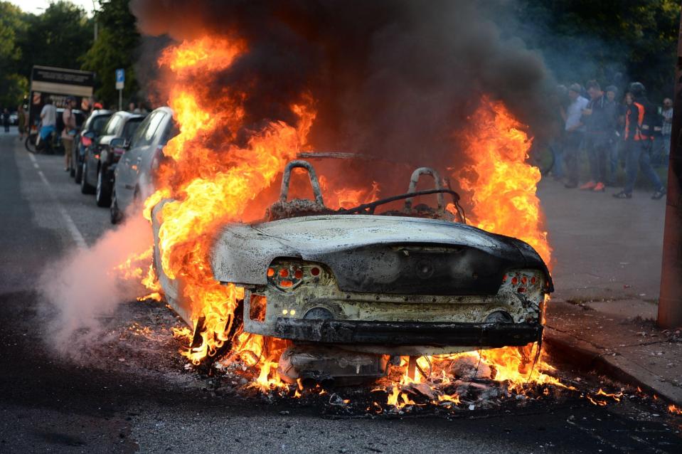A car is torched at the protest against the G20 summit in Hamburg