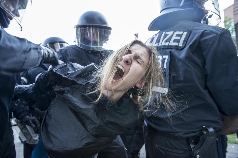 One activist was seen being dragged away by riot police