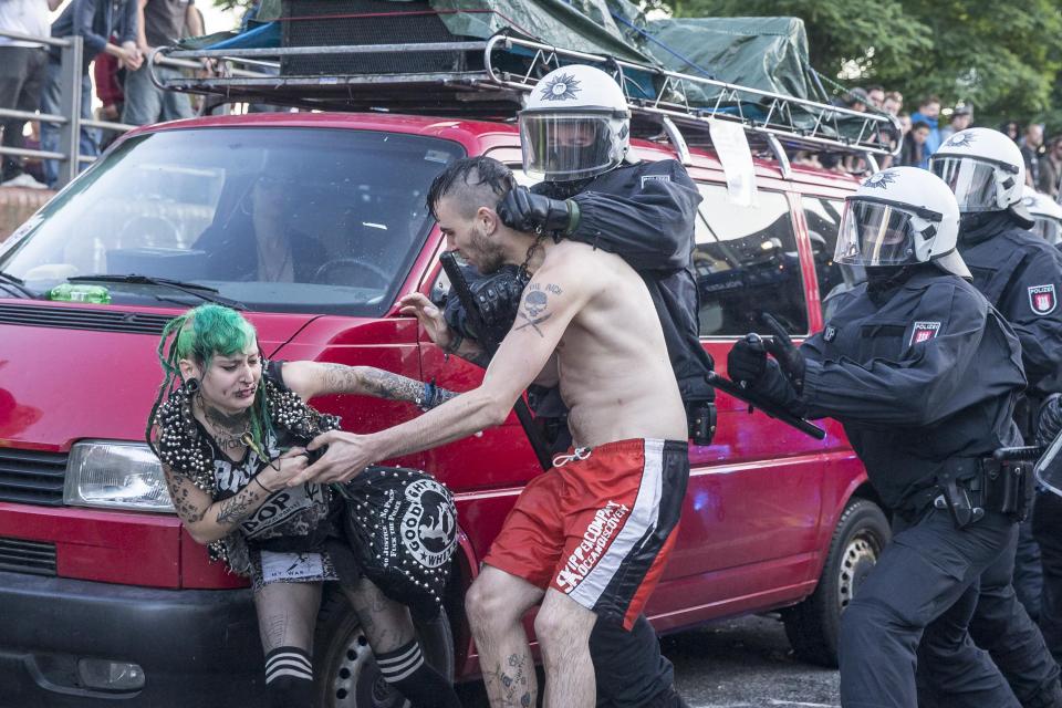 Police were seen holding a chain around one activist's neck