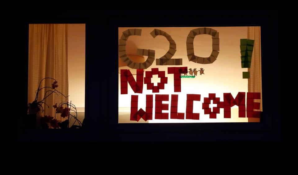 One protester wrote 'G20 not welcome' in a window