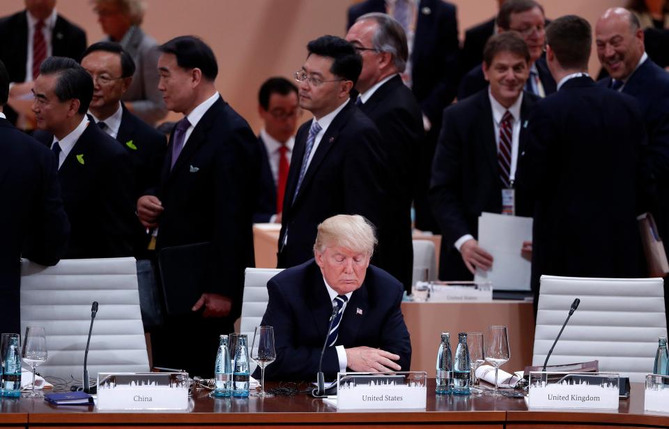  The New York property tycoon pictured sitting alone at the event