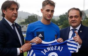 Januzaj poses with Real Sociedad's President and Sport Director