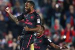 Alexandre Lacazette jumps for joy after netting the second goal of the match