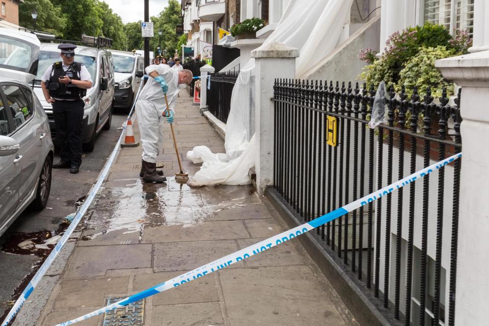  Forensic teams clean up after Danny was stabbed on the street
