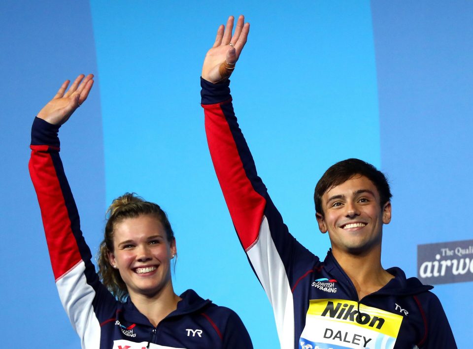  Tom Daley stood alongside Grace Reid on the podium after winning silver in the mixed synchronised 3m springboard