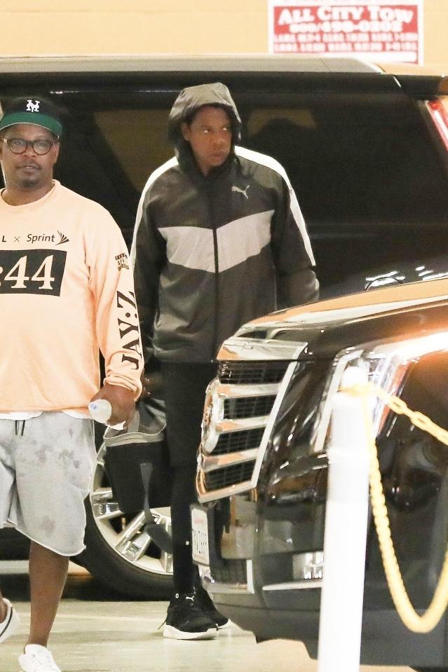  Jay Z covered up in his black hoodie