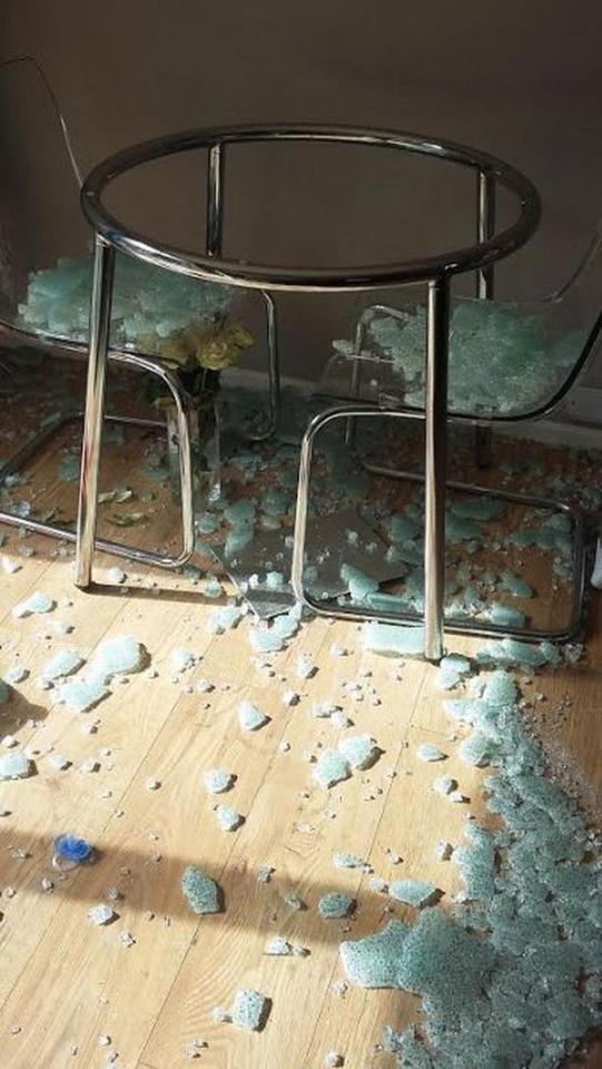  Pictures taken after the SALMI table shattered show shards of glass on the chairs and floor below