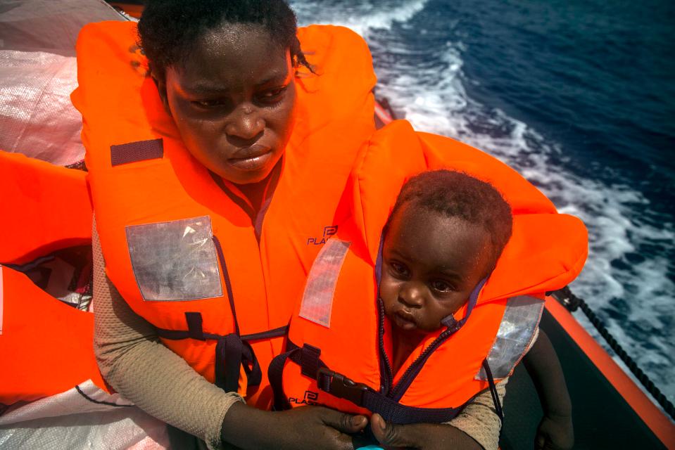  A Nigerian woman holds her baby on a Spanish rescue boat