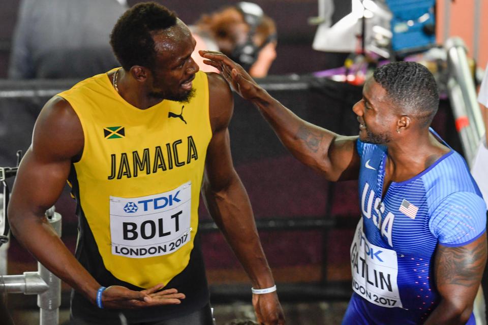 Bolt and Gatlin chat as they leave the track to show they are good friends