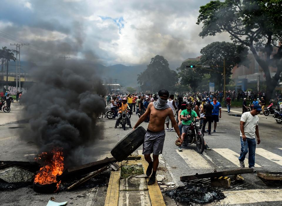  Anti government forces build a barricade in the street