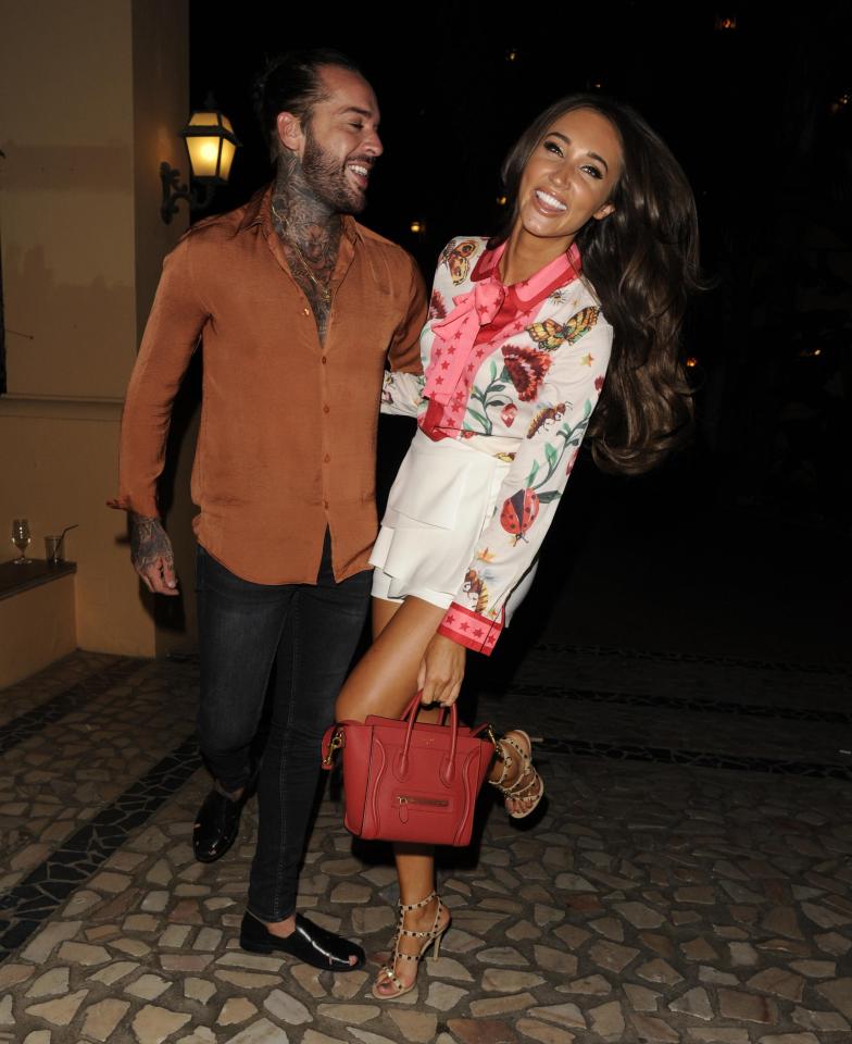 Megan looked thrilled to be on a night out with her tattooed beau