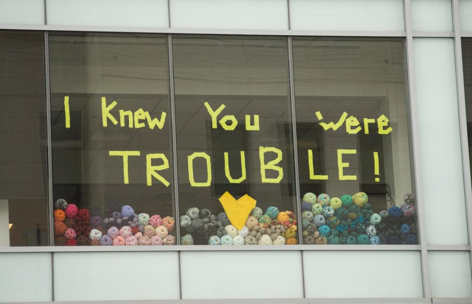  A message with Taylor Swift's lyrics is displayed across the street from the court