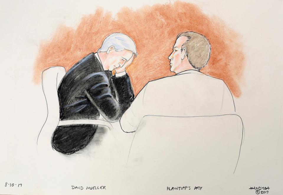  A court sketch of Mueller holding his head in his hand