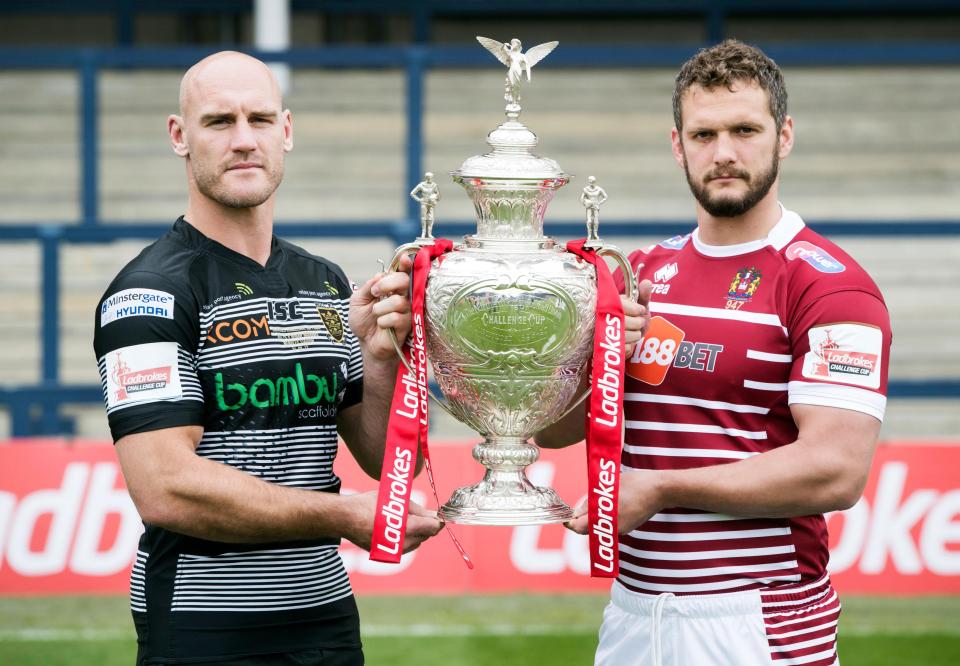 Hull FC captain Gareth Ellis, left, and Wigan Warriors skipper Sean O'Loughlin pose with the Challenge Cup trophy