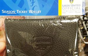 Leeds United flog official season ticket wallet to fans... with an Arsenal badge on the front