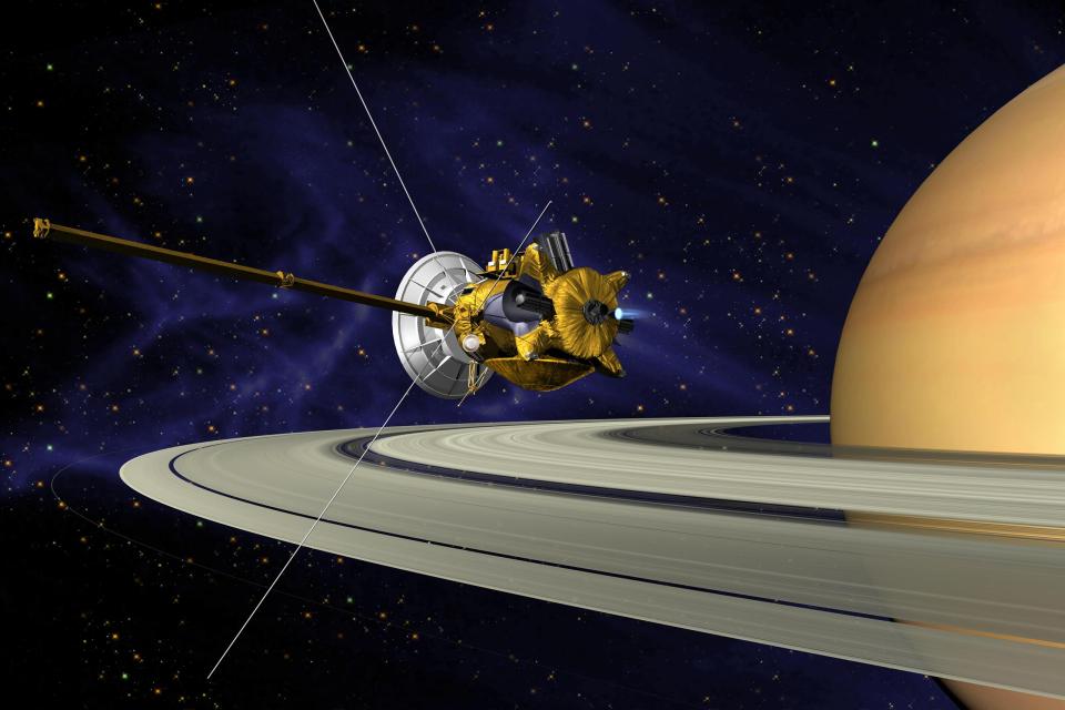  An artist's impression of Cassini zooming past Saturn